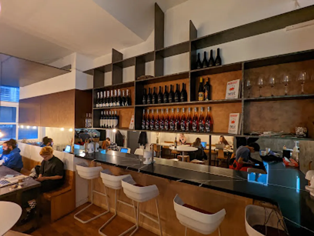 Interior view of Lion's Milk cafe showing customers and Turkish decor