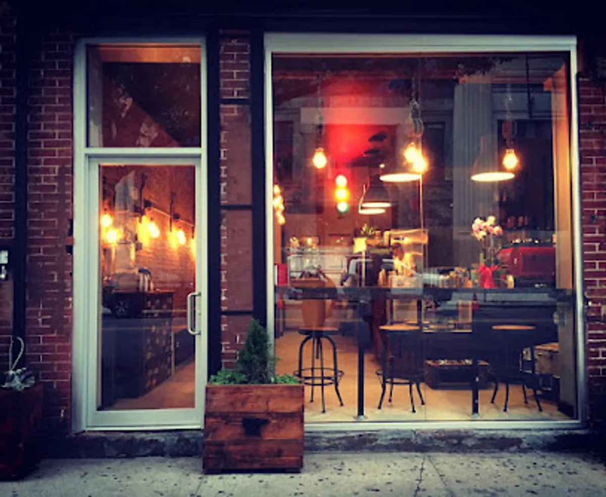Interior view of Cup of Brooklyn cafe, featuring cozy seating and vibrant decor