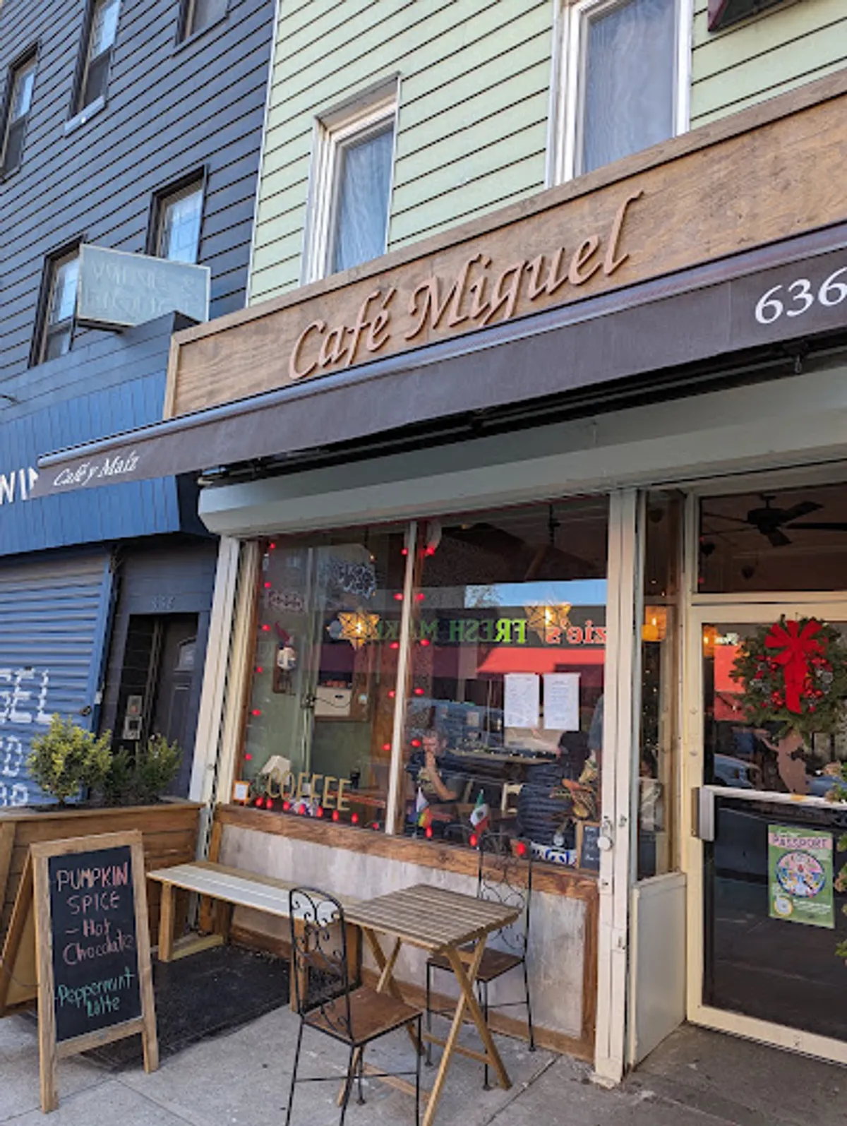 Interior view of Café Miguel, showcasing vibrant décor and patrons enjoying meals