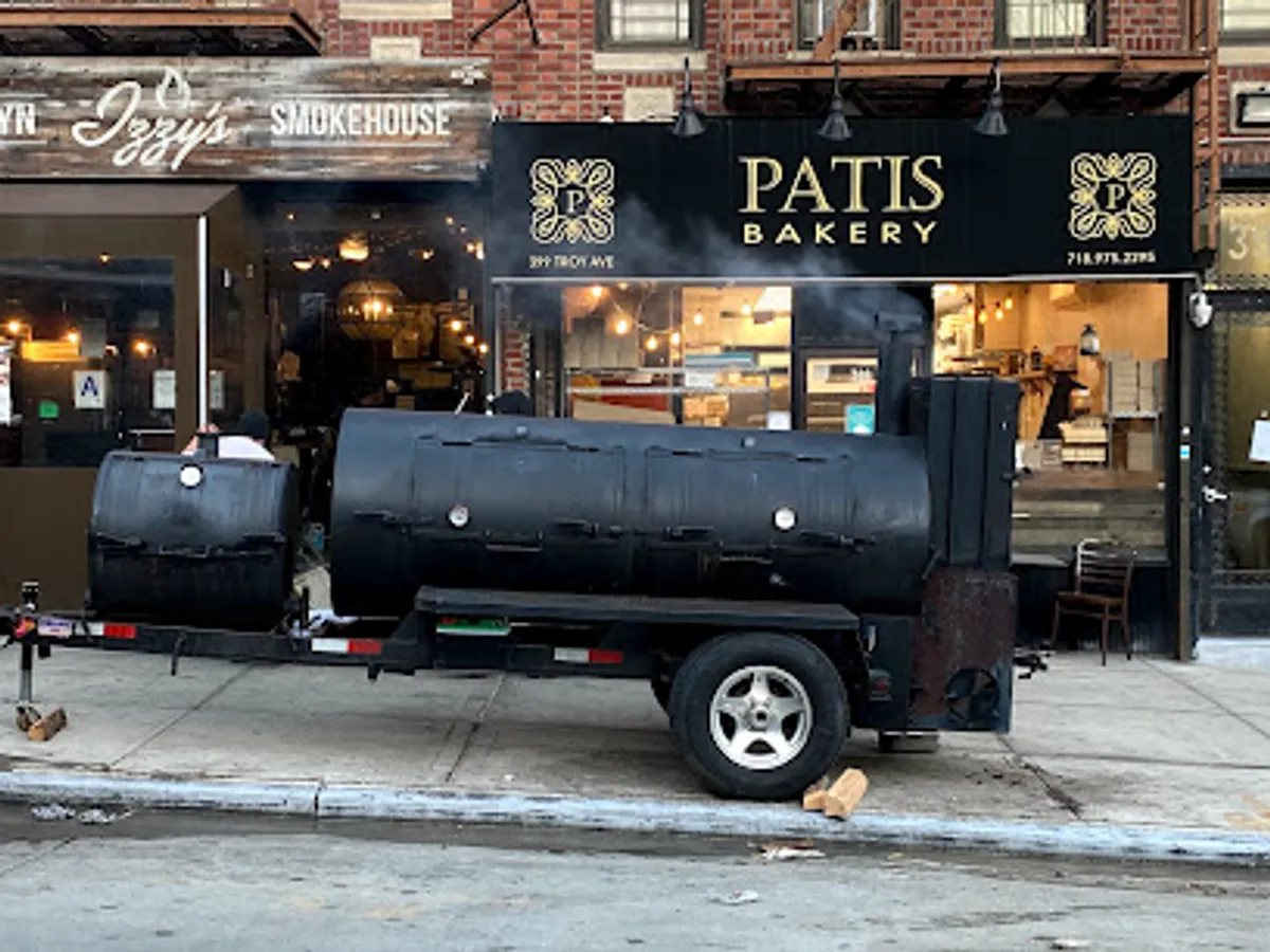 Interior view of Izzy's Brooklyn Smokehouse with guests dining