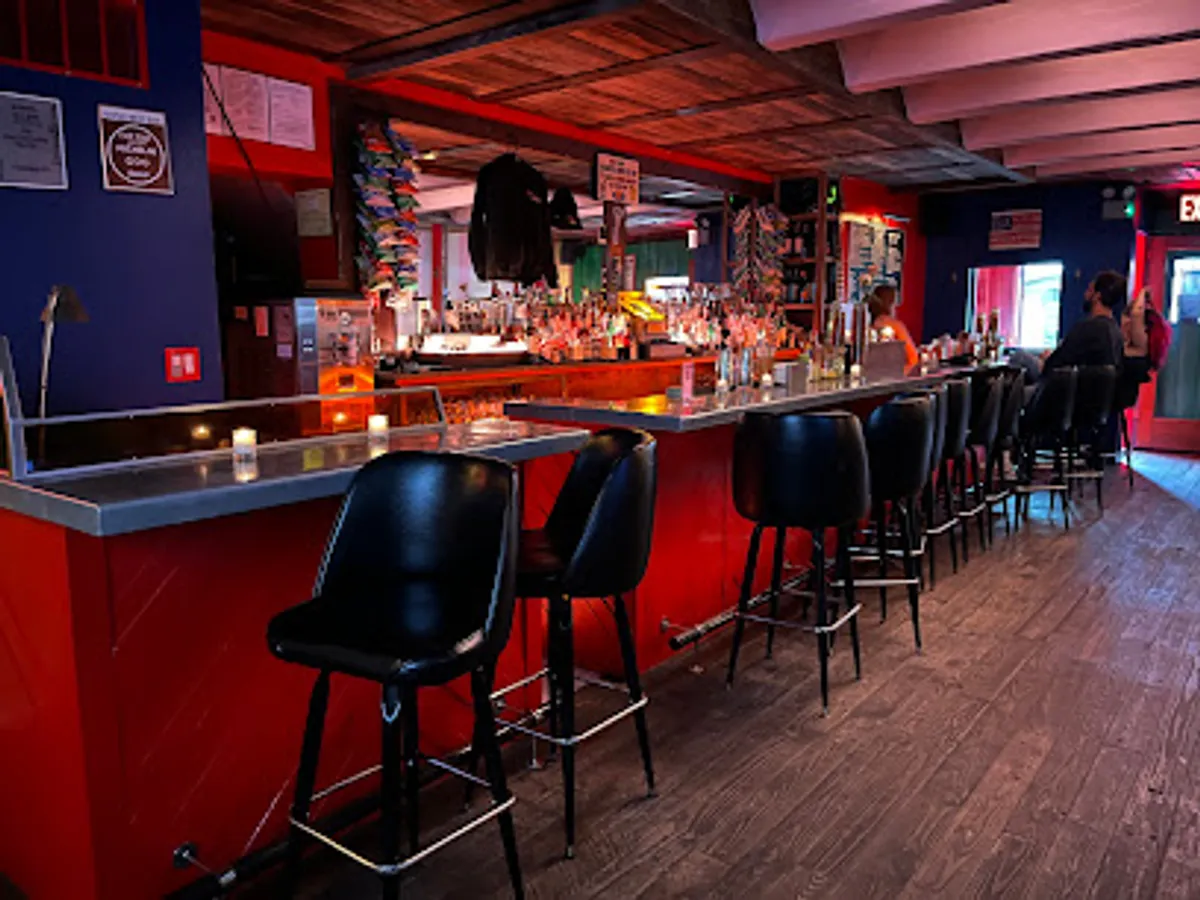 Interior view of ORE BAR in Williamsburg showing patrons enjoying drinks
