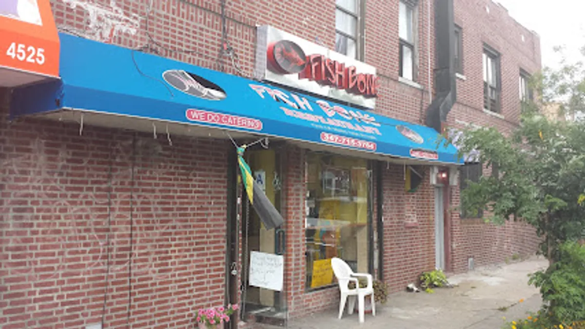 Interior view of Fish Bone restaurant filled with diners enjoying Jamaican cuisine