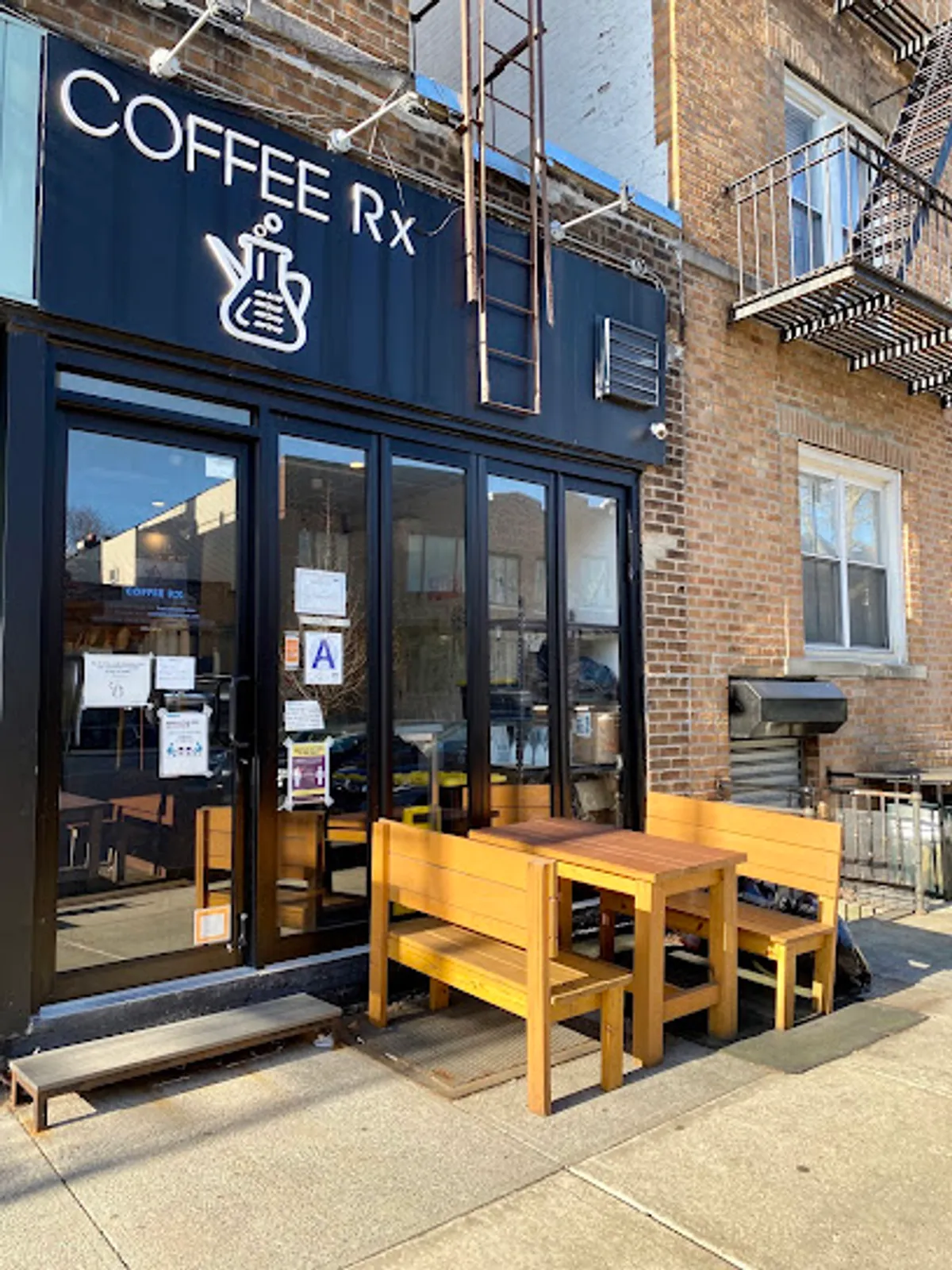 Interior view of Coffee Rx coffee shop in Brooklyn with customers