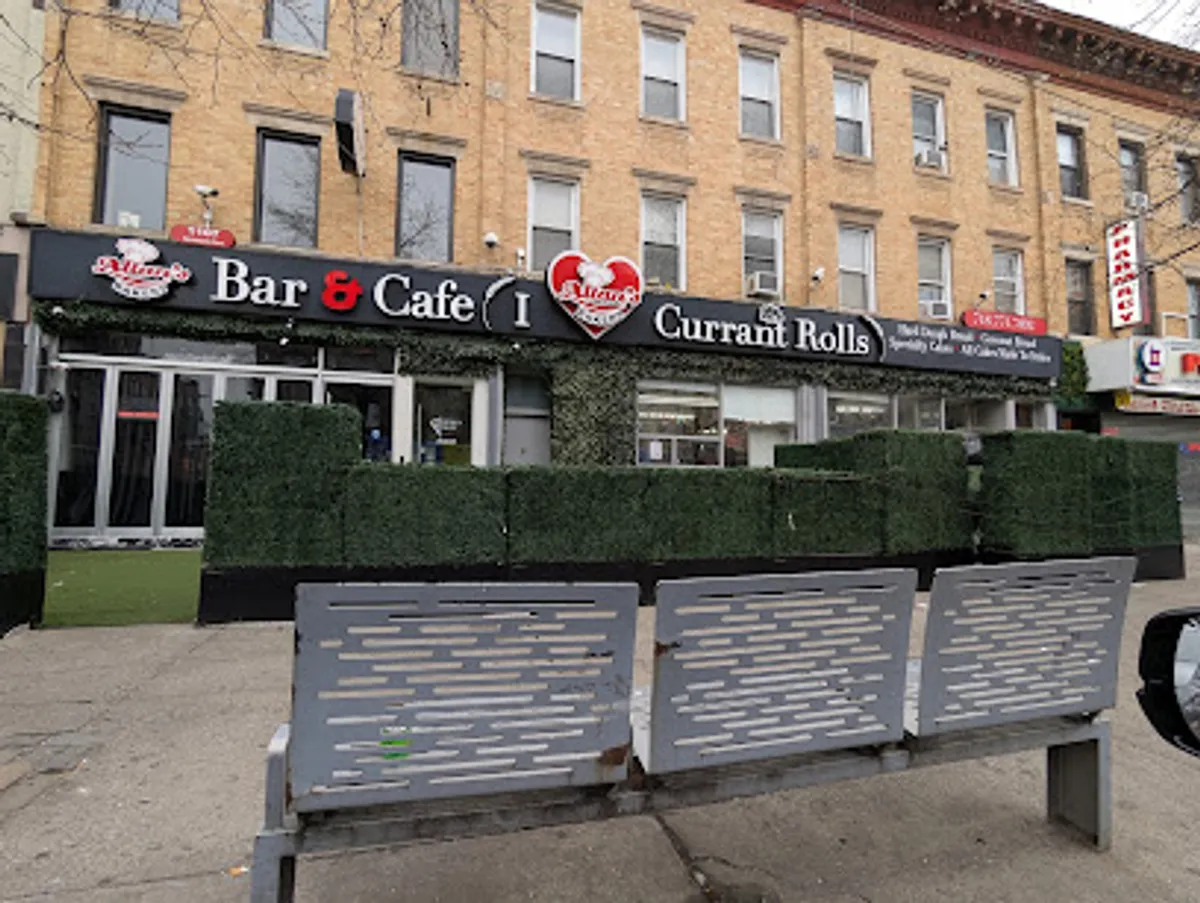 Interior view of Allan's Bakery showcasing various Caribbean pastries and breads