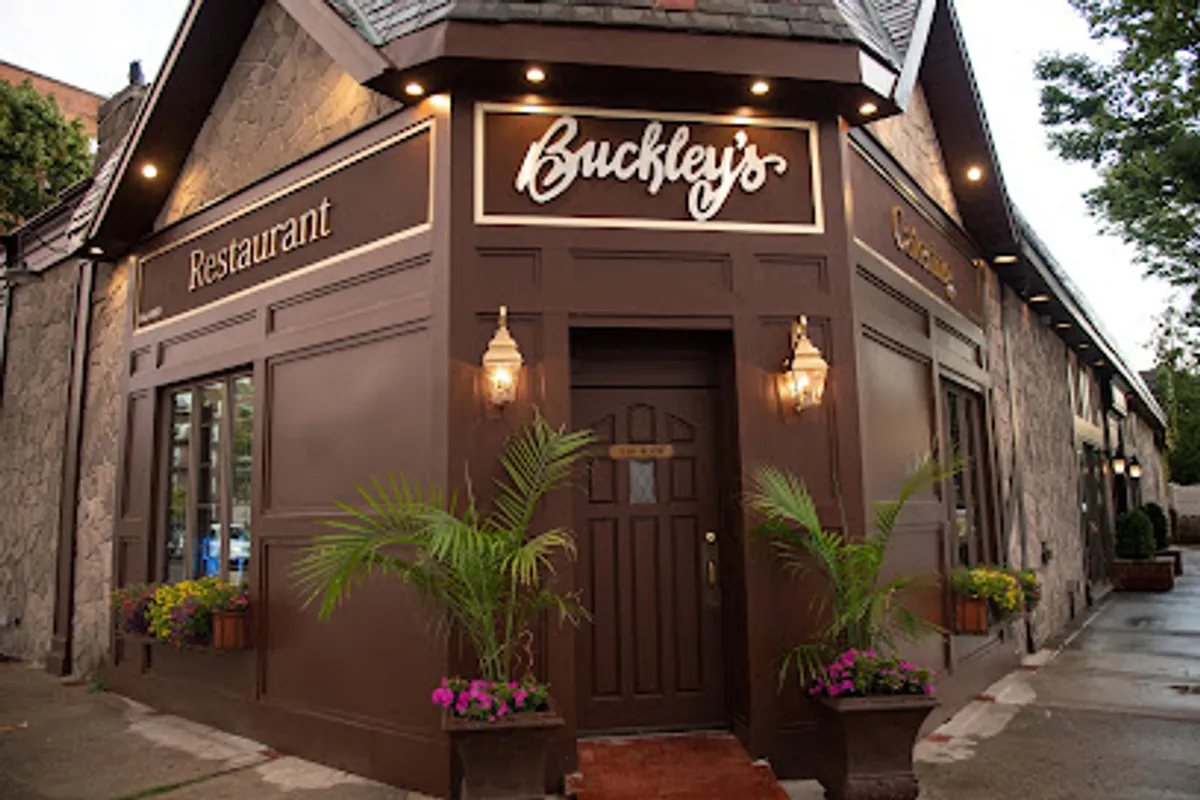 Interior view of Buckley's restaurant showing tables and a fireplace