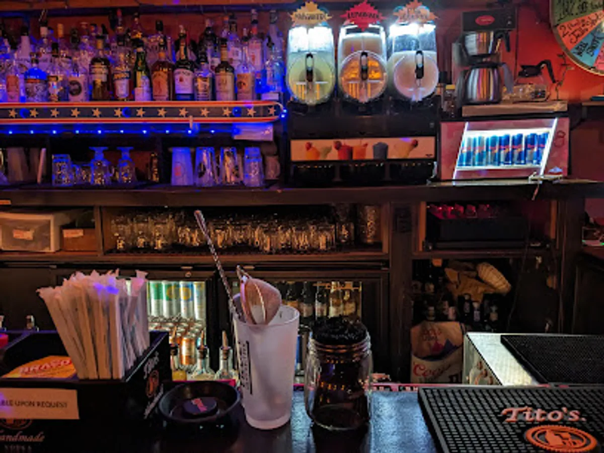 Interior view of Echo Bravo bar in Bushwick with patrons enjoying drinks