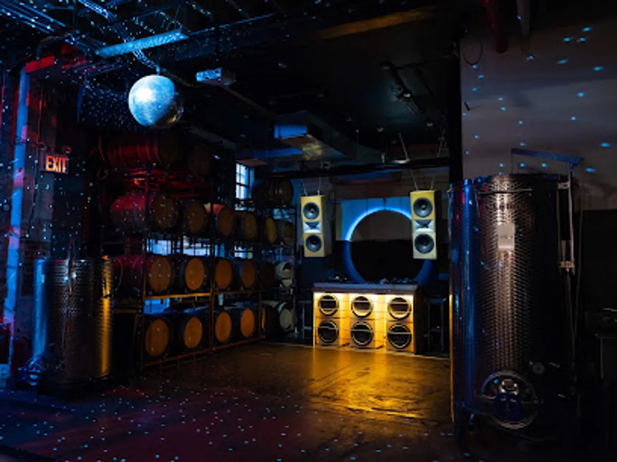 Trendy interior of Honey's bar with guests enjoying drinks