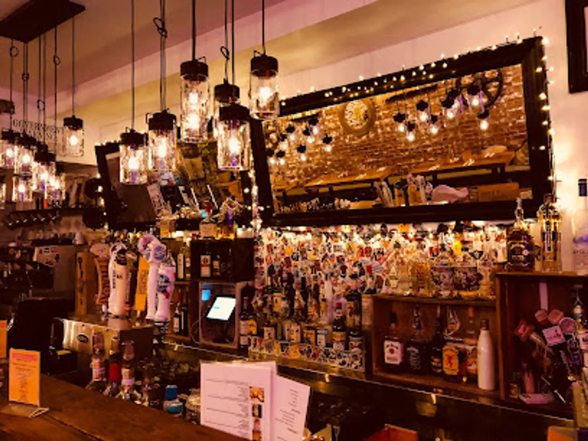Customers enjoying their meal inside Bar Basic, a popular Brooklyn gastropub.