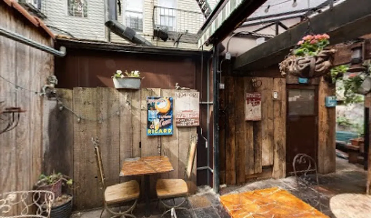 Interior view of Mominette Bistro showing tables and vintage decor