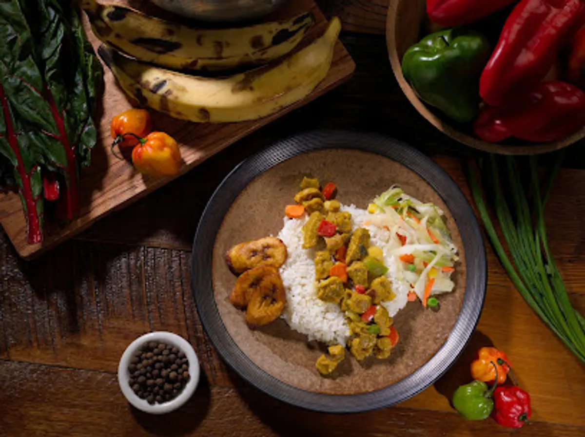 Interior view of Golden Krust Caribbean Restaurant with customers dining