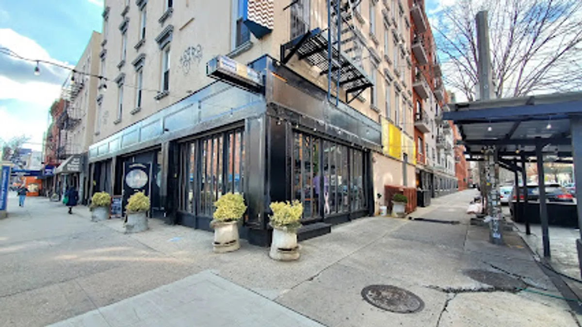 Cozy, dimly-lit dining area of Sweet Science with stylish decor