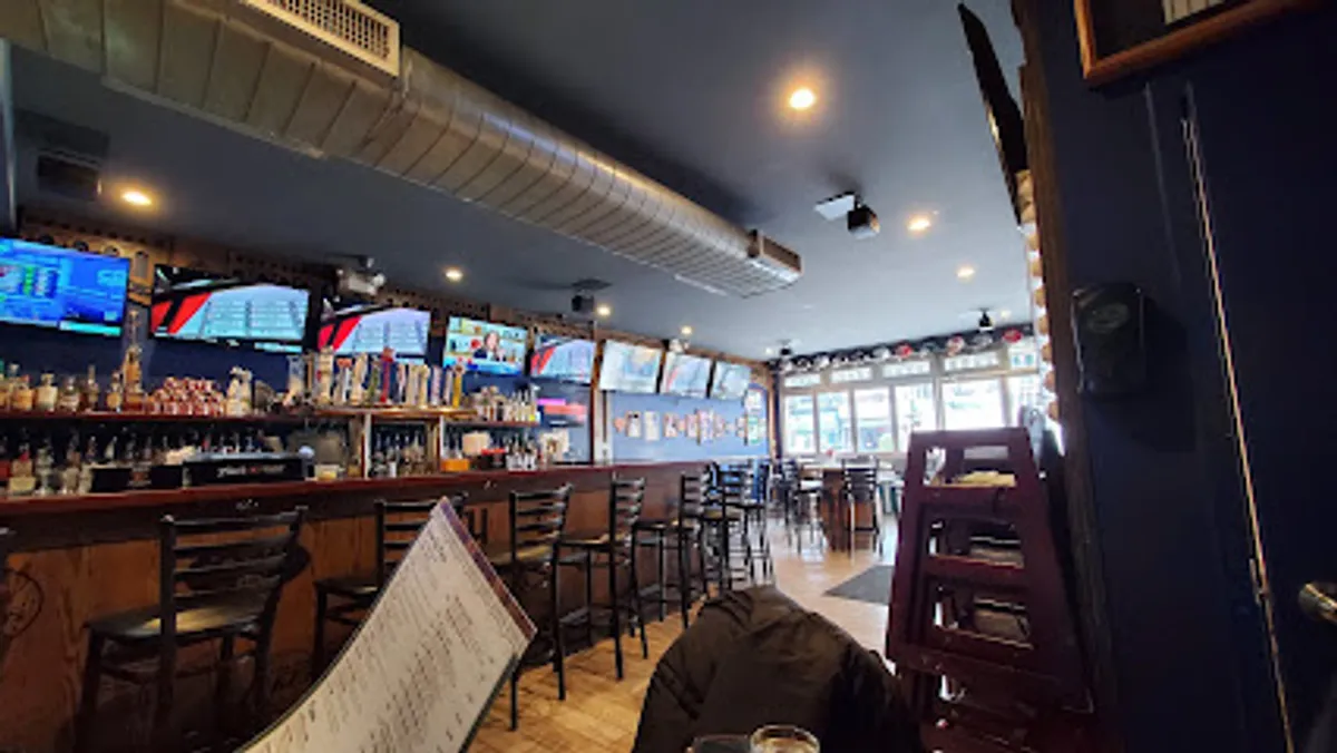 Interior of Carmine's Pizzeria in Williamsburg, bustling with diners.