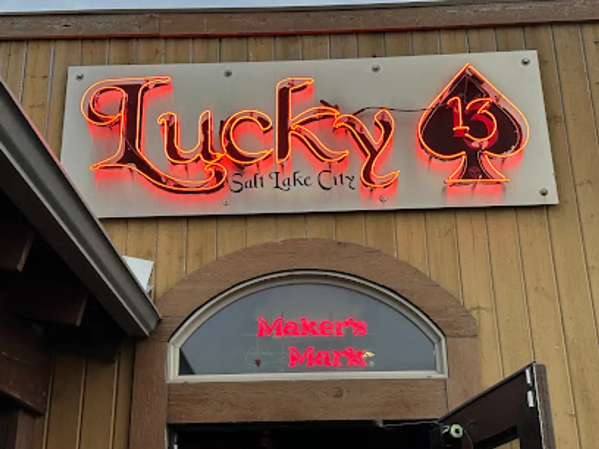 Crowded scene at Lucky 13 Saloon with live metal band performing