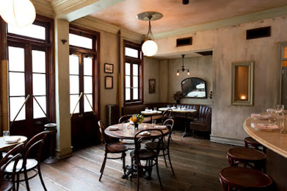 Interior view of Maison Premiere showing detailed decor and dining ambiance