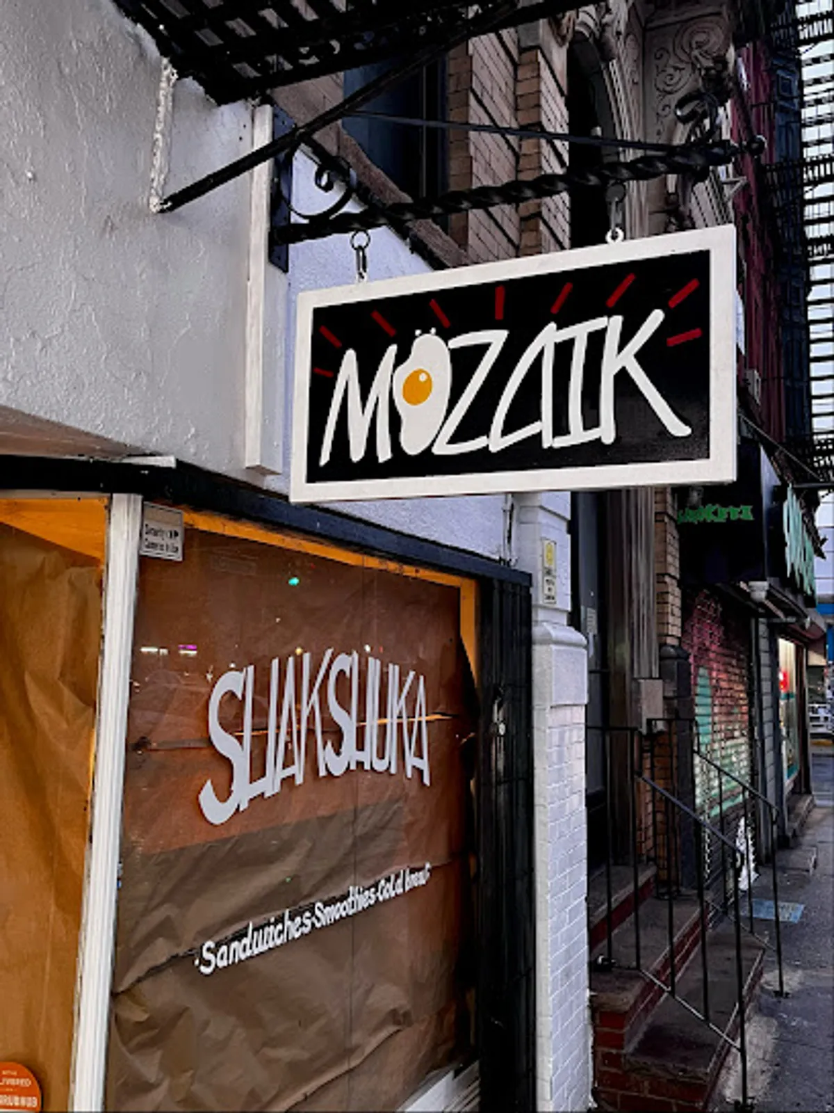 Interior view of Mozaik Cafe in Brooklyn with customers dining