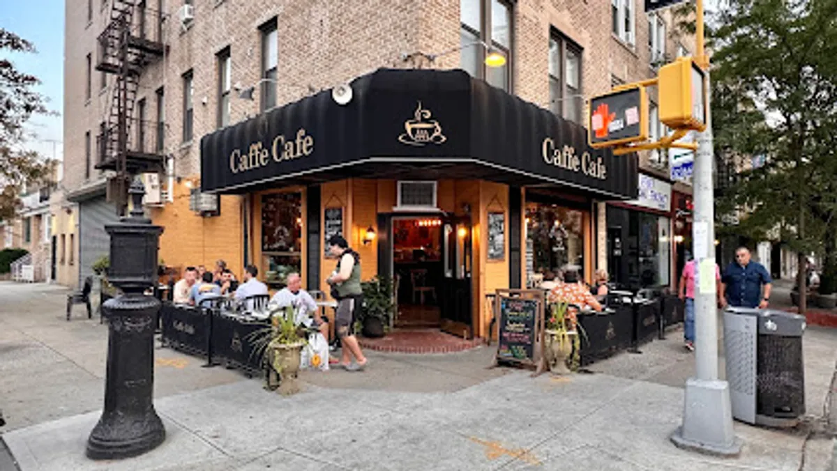 Interior view of Caffe Café in Brooklyn showing customers and baristas