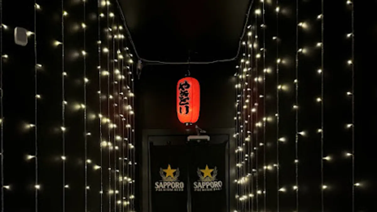 Interior view of THE LAST CALL bar bustling with patrons in Williamsburg