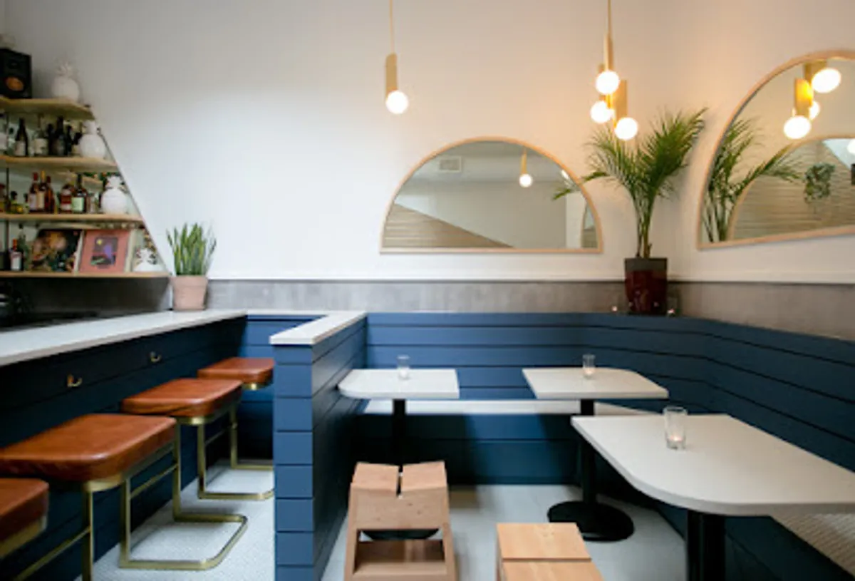 Cozy and stylish interior of The Hidden Pearl cocktail bar in Brooklyn