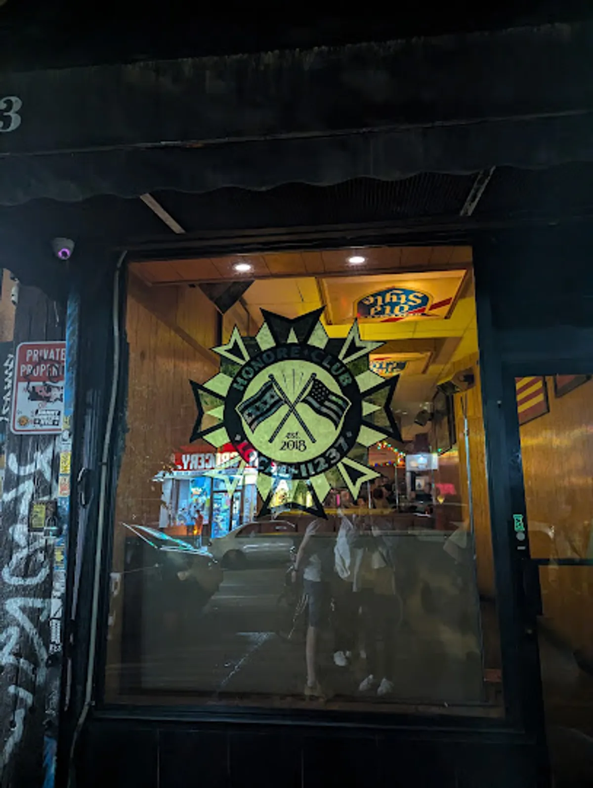 Interior view of Honore Club in Brooklyn showing patrons enjoying drinks