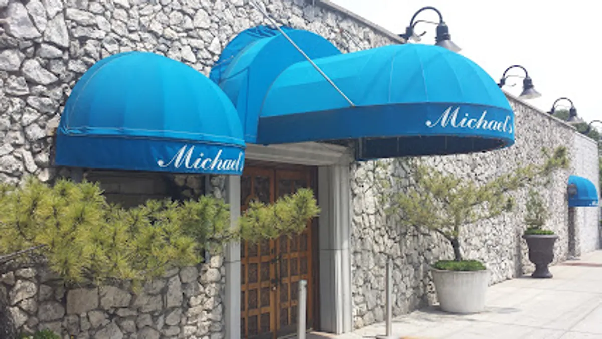 Interior view of Michael's of Brooklyn showing tables set for dining